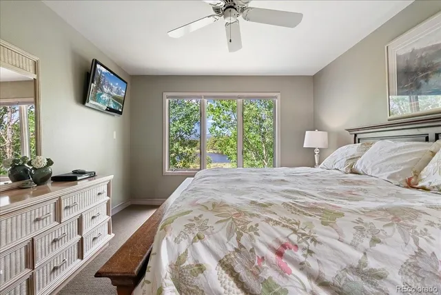 a bedroom with a bed and a dresser in it