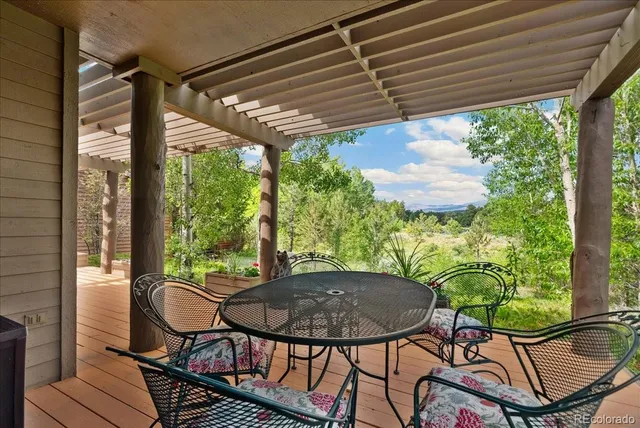 a view of a patio in a backyard