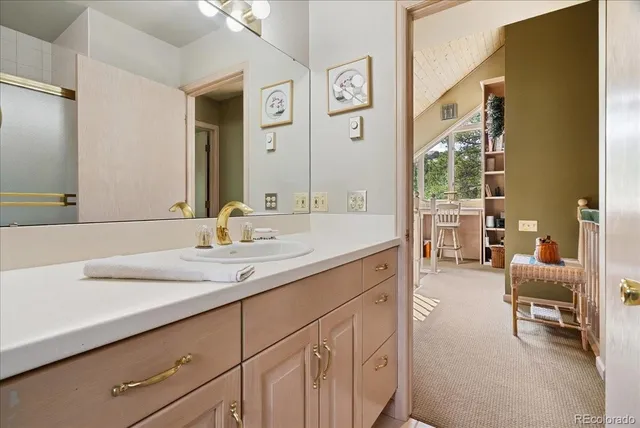 a spacious bathroom with a double vanity sink and a mirror