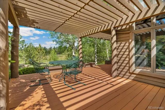 a view of a chairs and table on the wooden floor