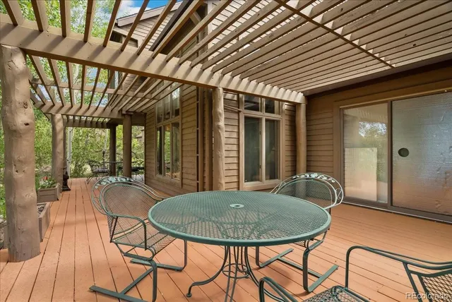 a dinning table and chairs in a patio