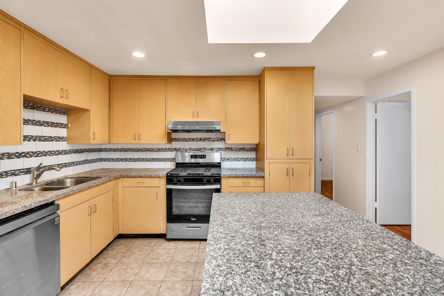 200 Dorita Way Modesto, CA 95354 - Photo 15 of 37 a kitchen with a sink stove and refrigerator