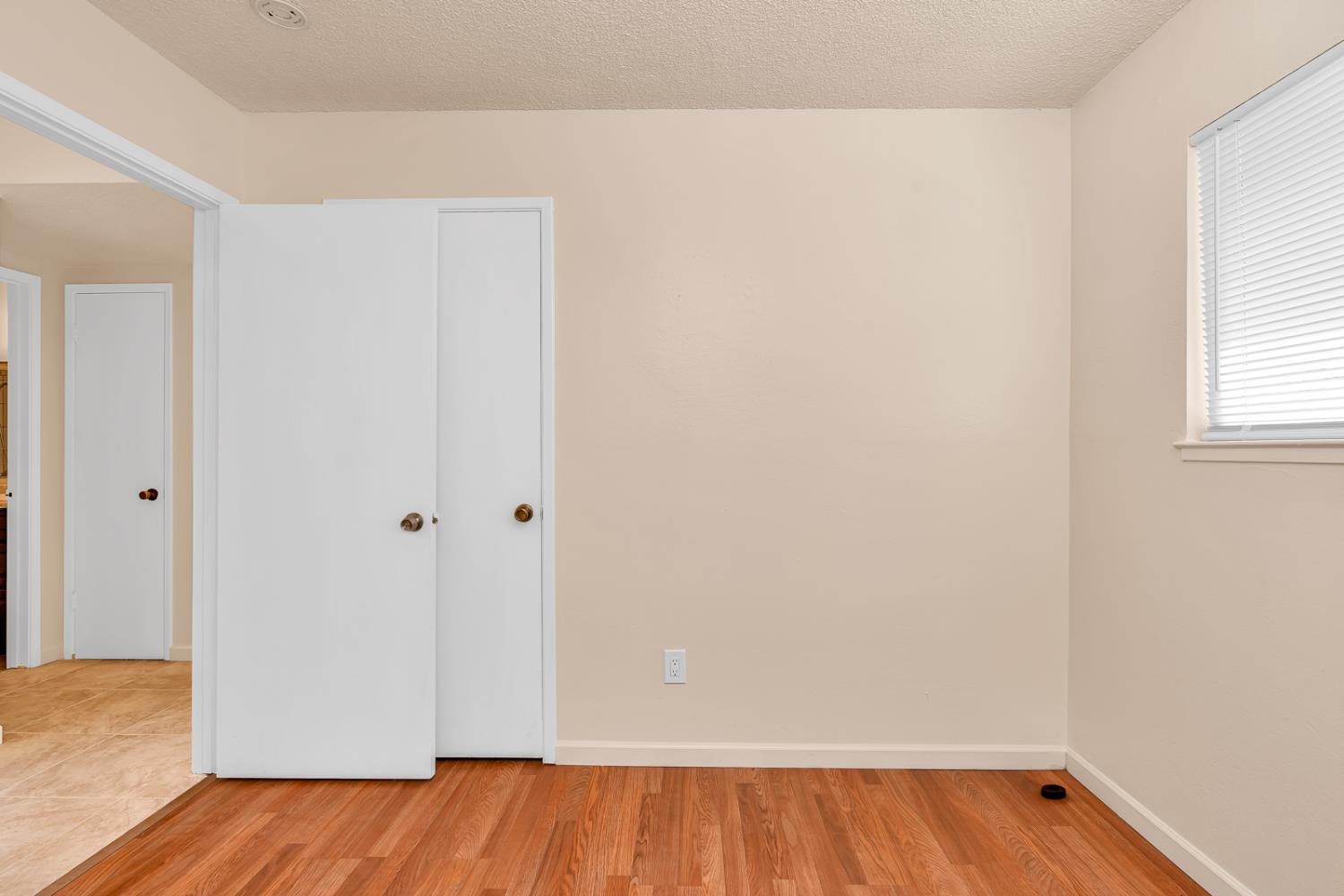200 Dorita Way Modesto, CA 95354 - Photo 20 of 37 a view of a room with wooden floor and a window