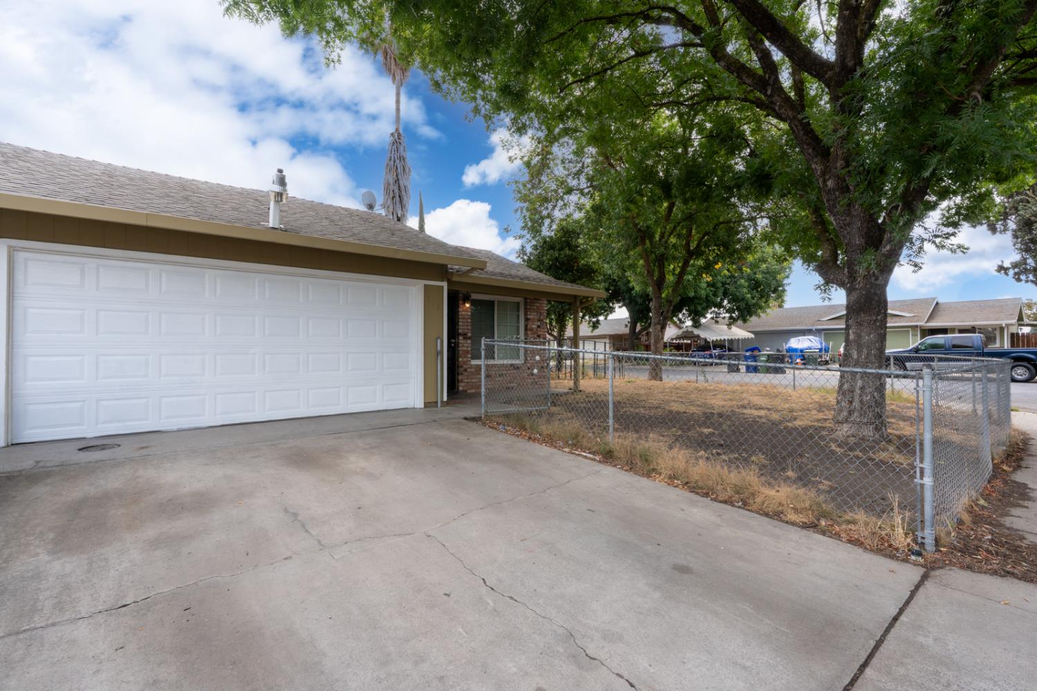 200 Dorita Way Modesto, CA 95354 - Photo 2 of 37 a view of a street with a tree