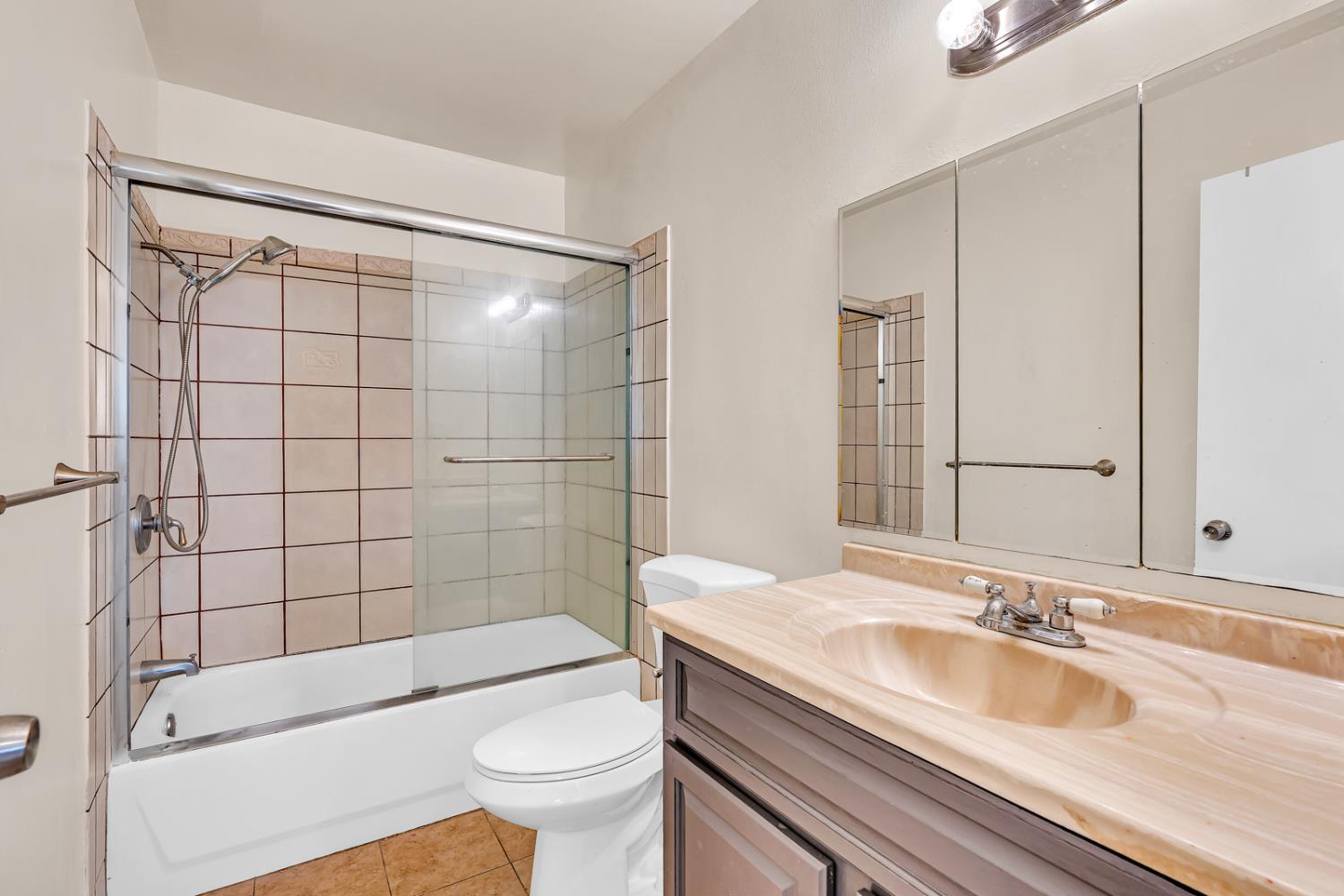 200 Dorita Way Modesto, CA 95354 - Photo 21 of 37 a bathroom with a sink a toilet and shower