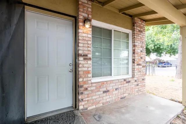 a view of a door and a window