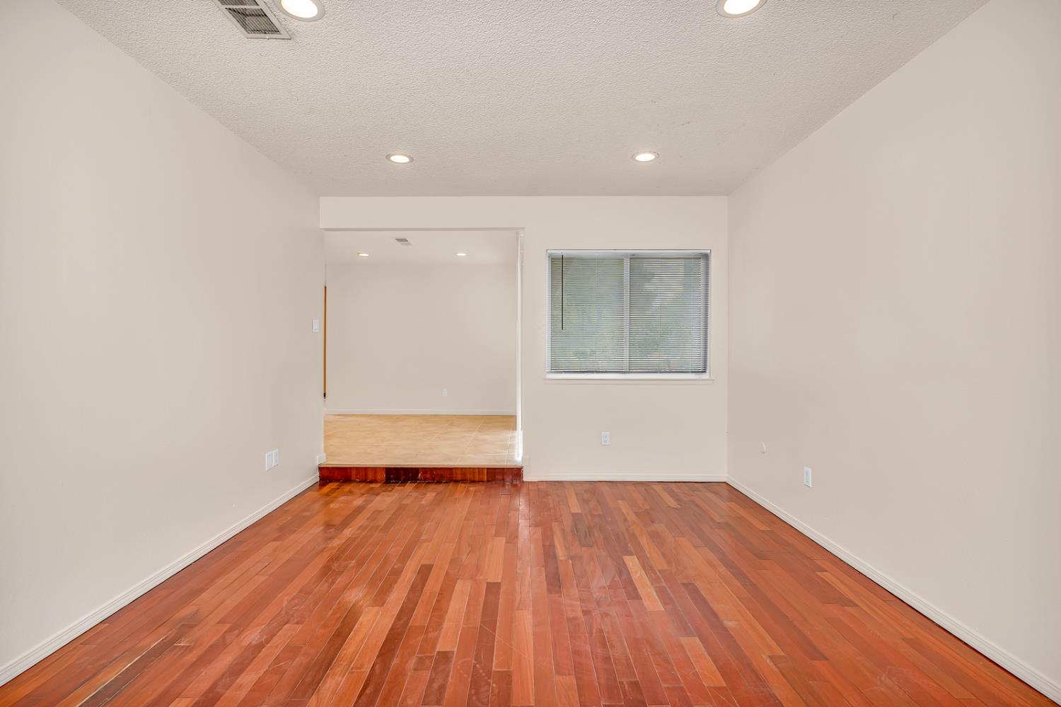 200 Dorita Way Modesto, CA 95354 - Photo 7 of 37 a view of an empty room with wooden floor