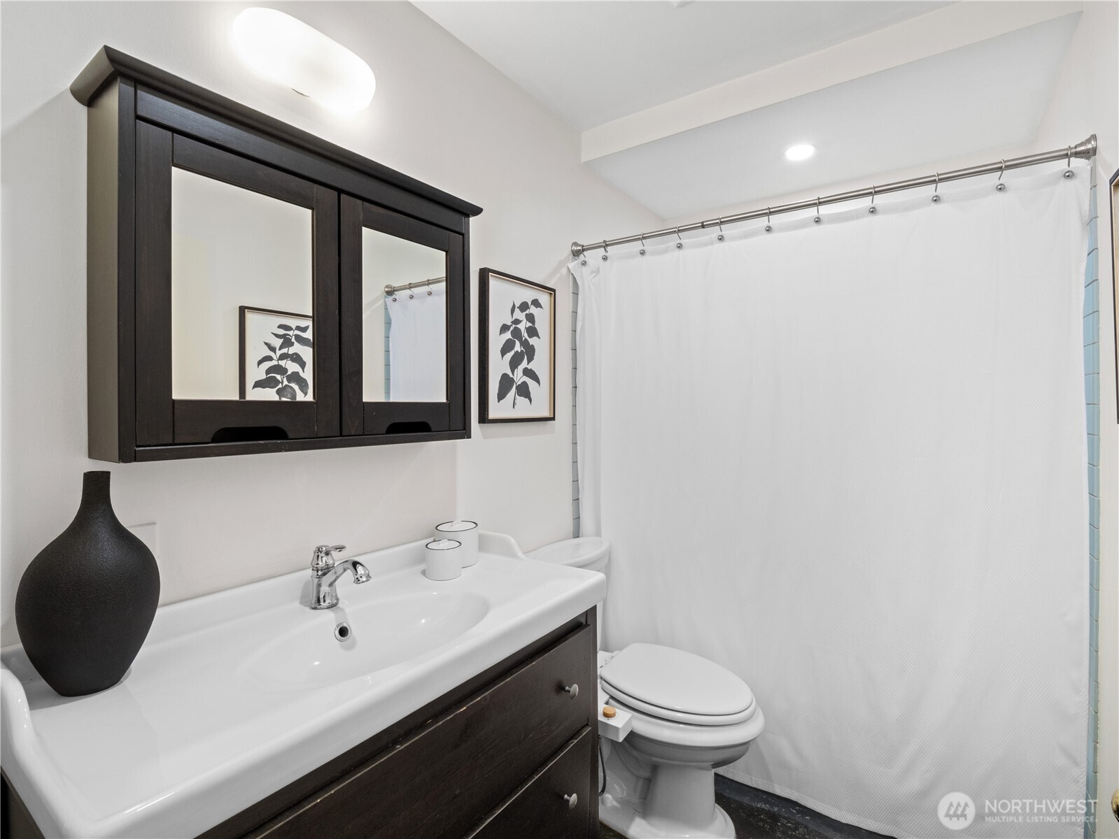 11640 59th Avenue South Seattle, WA 98178 - Photo 13 of 33 a bathroom with a sink toilet and mirror
