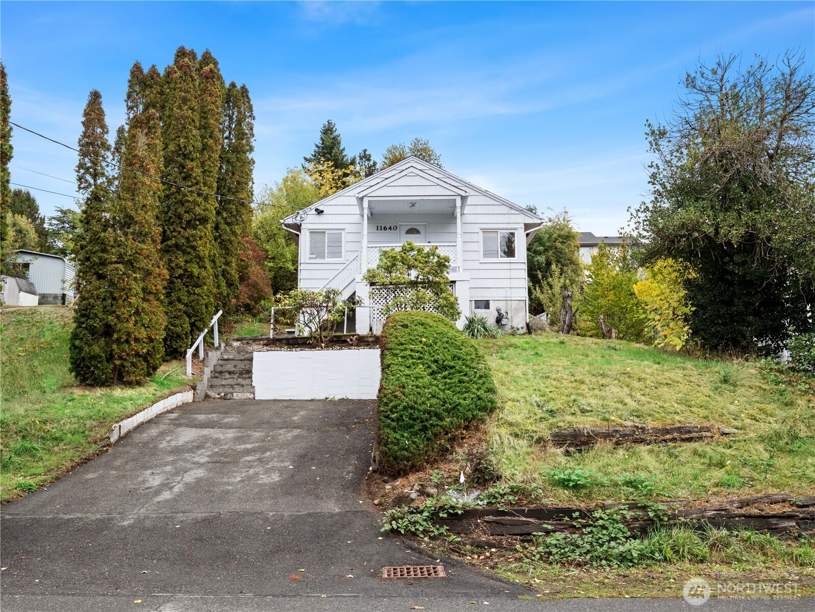 11640 59th Avenue South Seattle, WA 98178 - Photo 27 of 33 a front view of a house with a yard and a garden