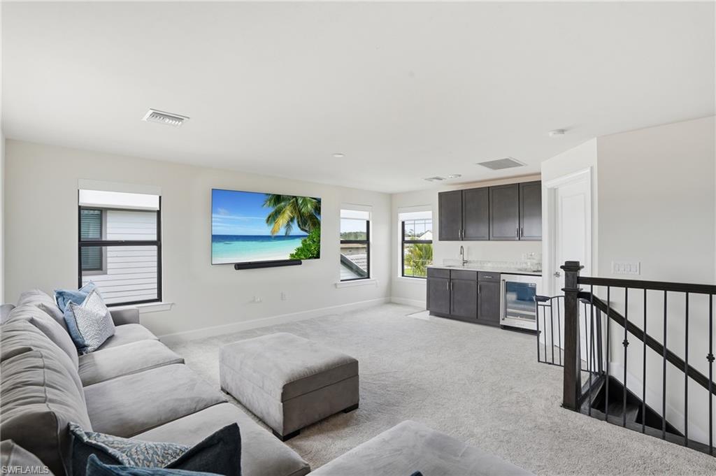 19696 Aqua View Lane Fort Myers, FL 33913 - Photo 27 of 50 a living room with furniture and a flat screen tv