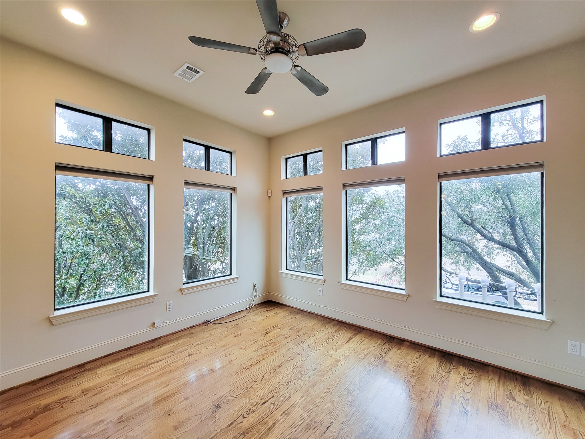 1602 White Street Houston, TX 77007 - Photo 14 of 41 a view of an empty room with a window and wooden floor