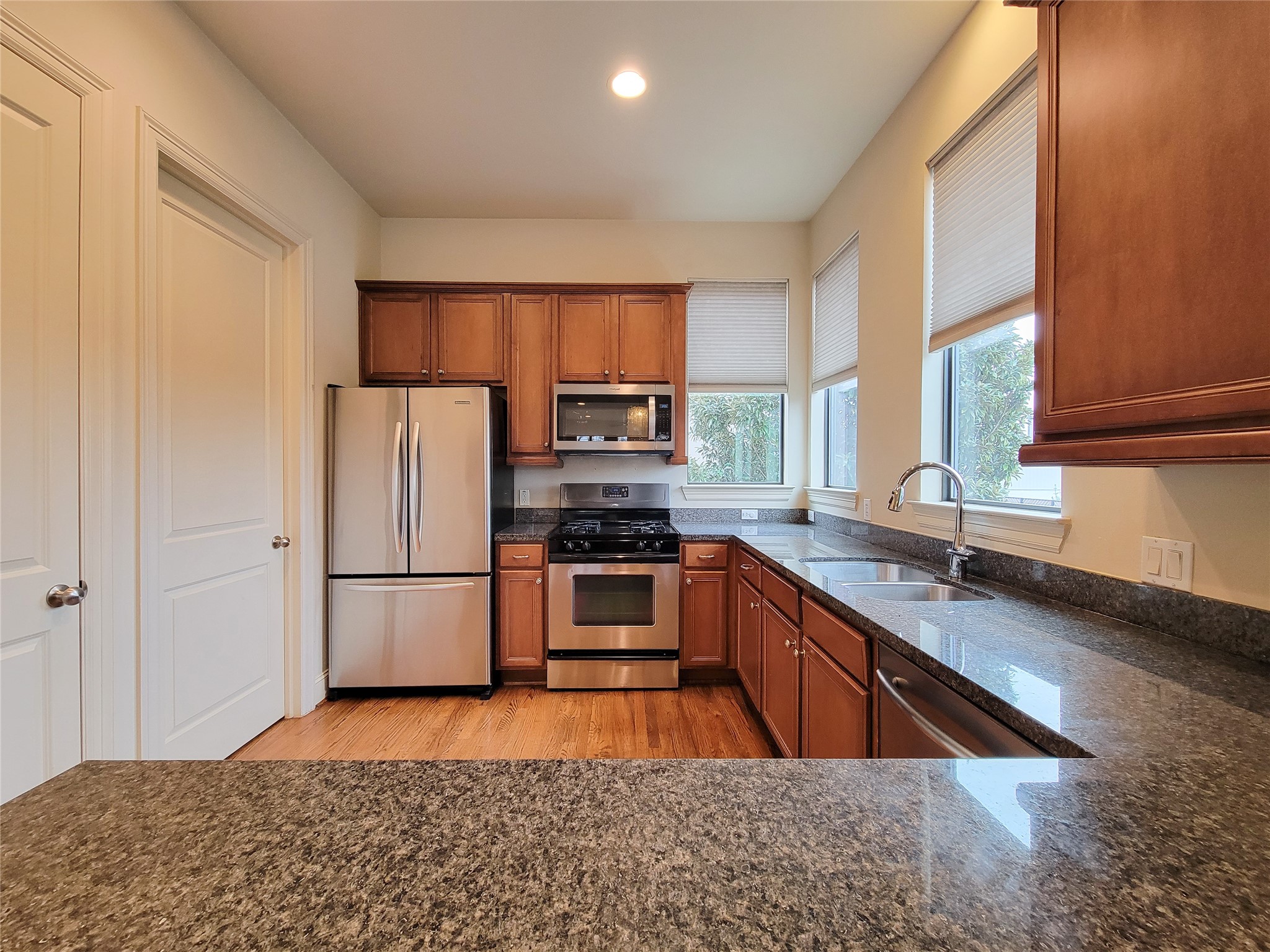 1602 White Street Houston, TX 77007 - Photo 18 of 41 a kitchen with stainless steel appliances granite countertop a refrigerator sink and stove