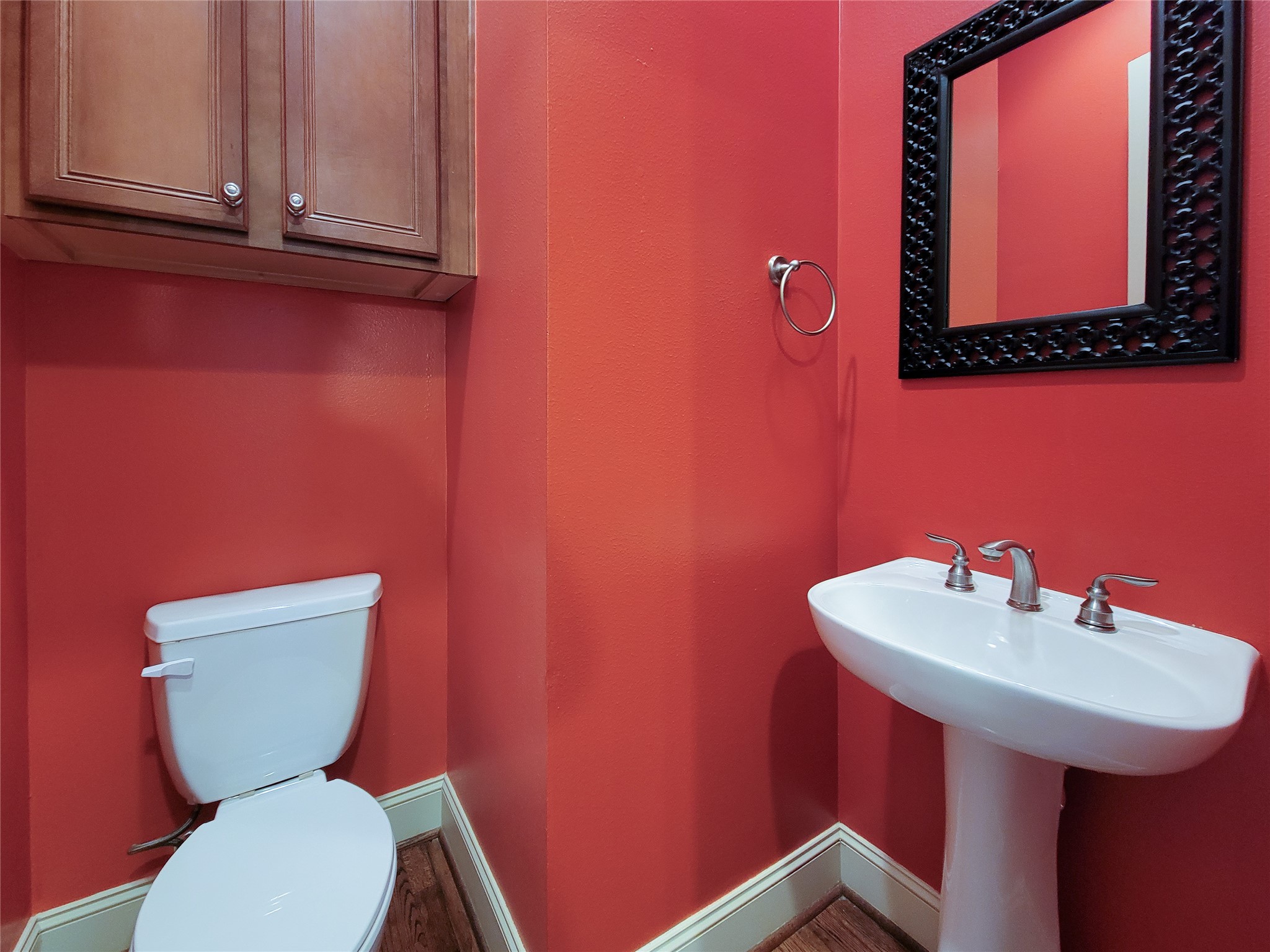 1602 White Street Houston, TX 77007 - Photo 24 of 41 a bathroom with a toilet a sink and mirror