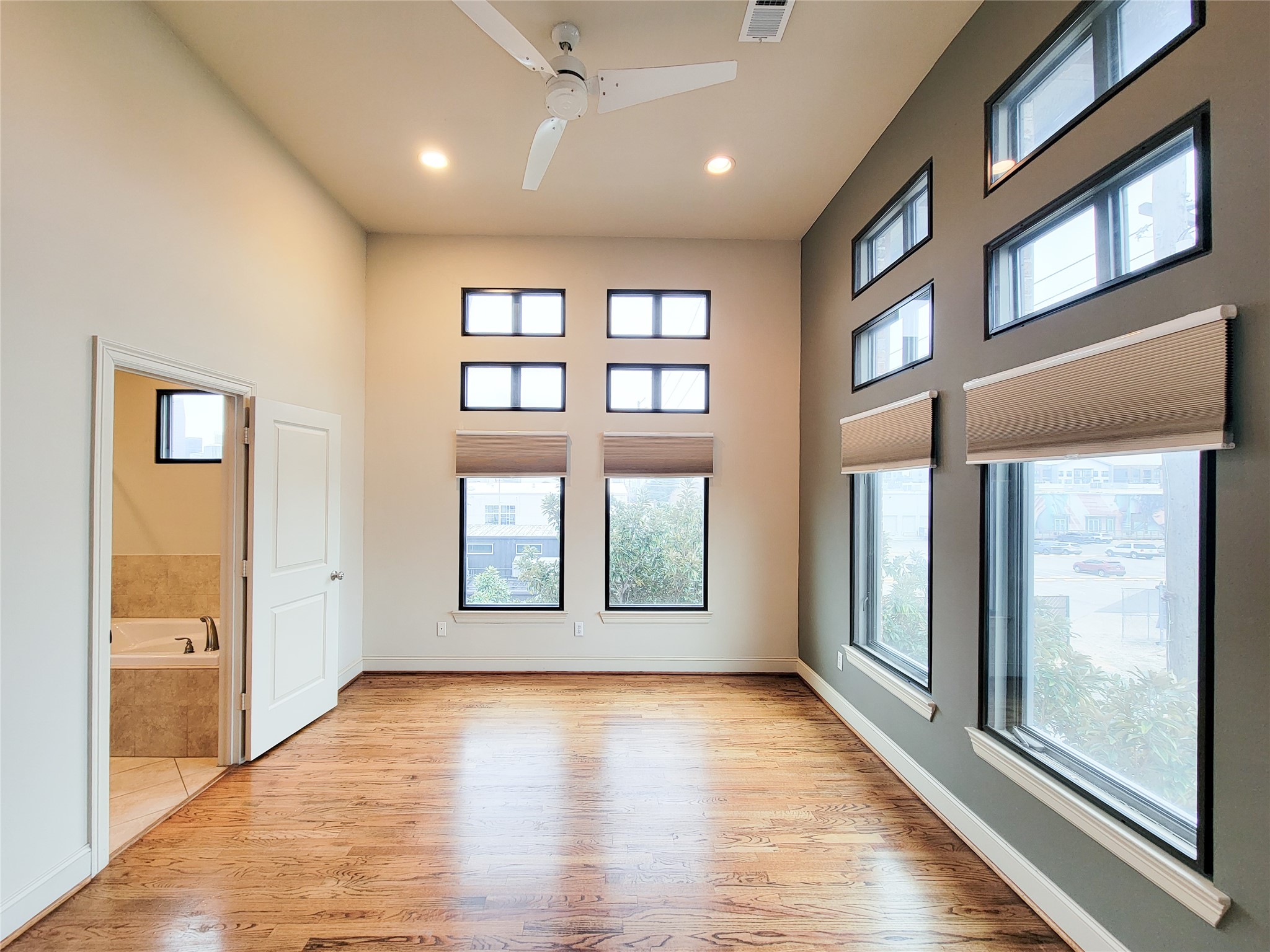 1602 White Street Houston, TX 77007 - Photo 27 of 41 a view of an empty room with a window and wooden floor
