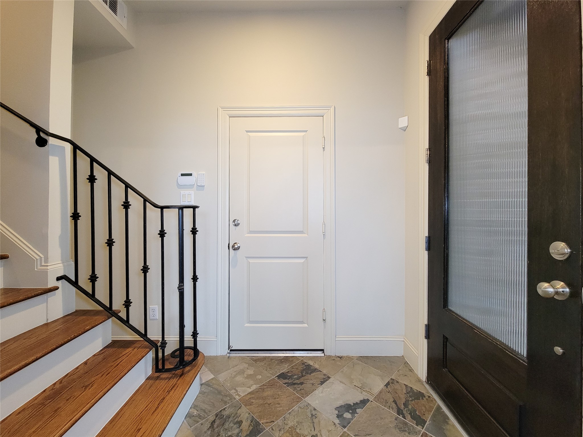 1602 White Street Houston, TX 77007 - Photo 4 of 41 a view of a hallway with wooden floor and staircase