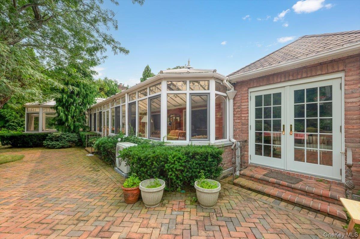 1331 Harbor Road Hewlett, NY 11557 - Photo 41 of 50 View of patio / terrace featuring a sunroom and french doors