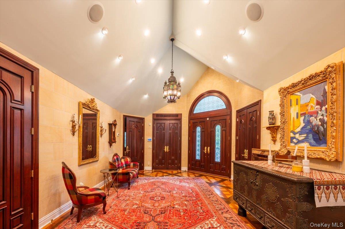 1331 Harbor Road Hewlett, NY 11557 - Photo 6 of 50 Foyer with high vaulted ceiling, a chandelier, and recessed lighting