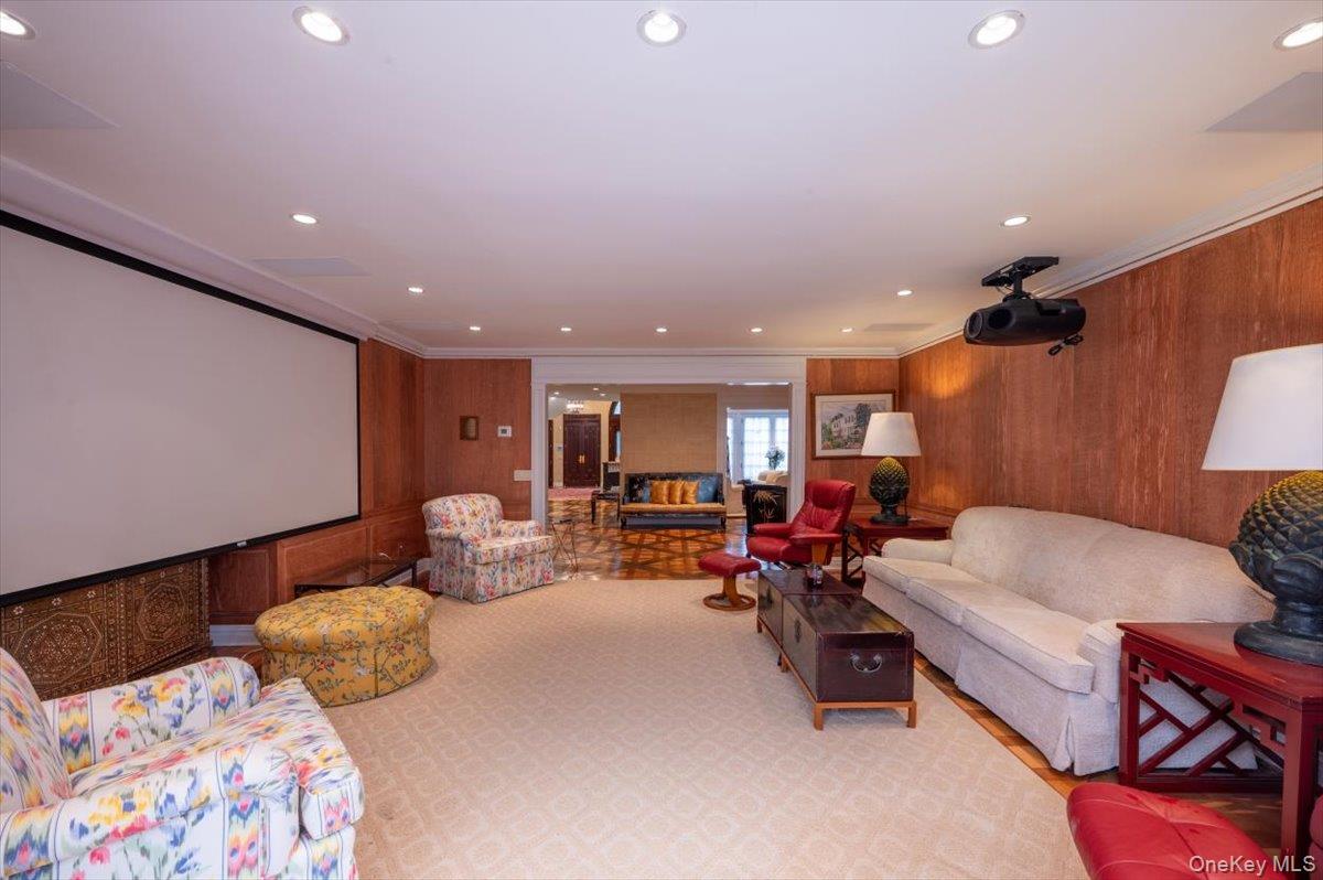 1331 Harbor Road Hewlett, NY 11557 - Photo 10 of 50 Home theater with ornamental molding, recessed lighting, and wood walls