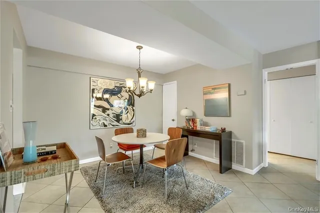 a view of a livingroom with furniture and a chandelier