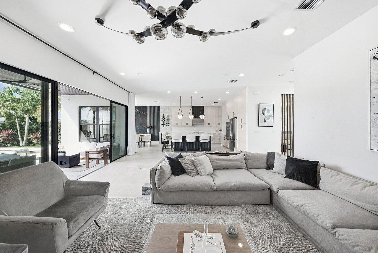 8092 Laurel Falls Drive Boca Raton, FL 33496 - Photo 15 of 62 a living room with furniture and a large window