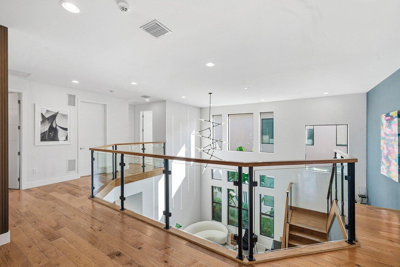 8092 Laurel Falls Drive Boca Raton, FL 33496 - Photo 17 of 62 a view of a hallway with seating area