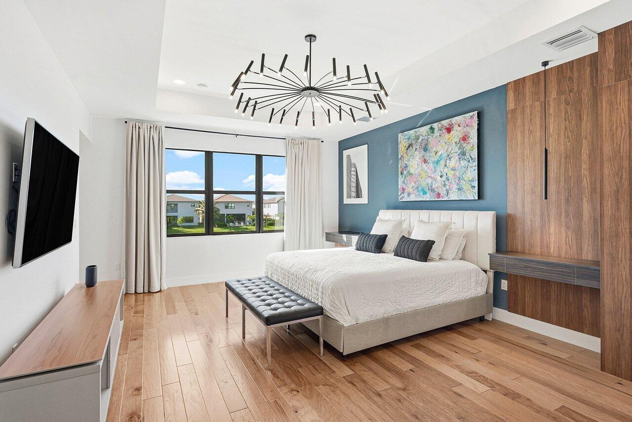 8092 Laurel Falls Drive Boca Raton, FL 33496 - Photo 20 of 62 a bedroom with a bed and a flat screen tv