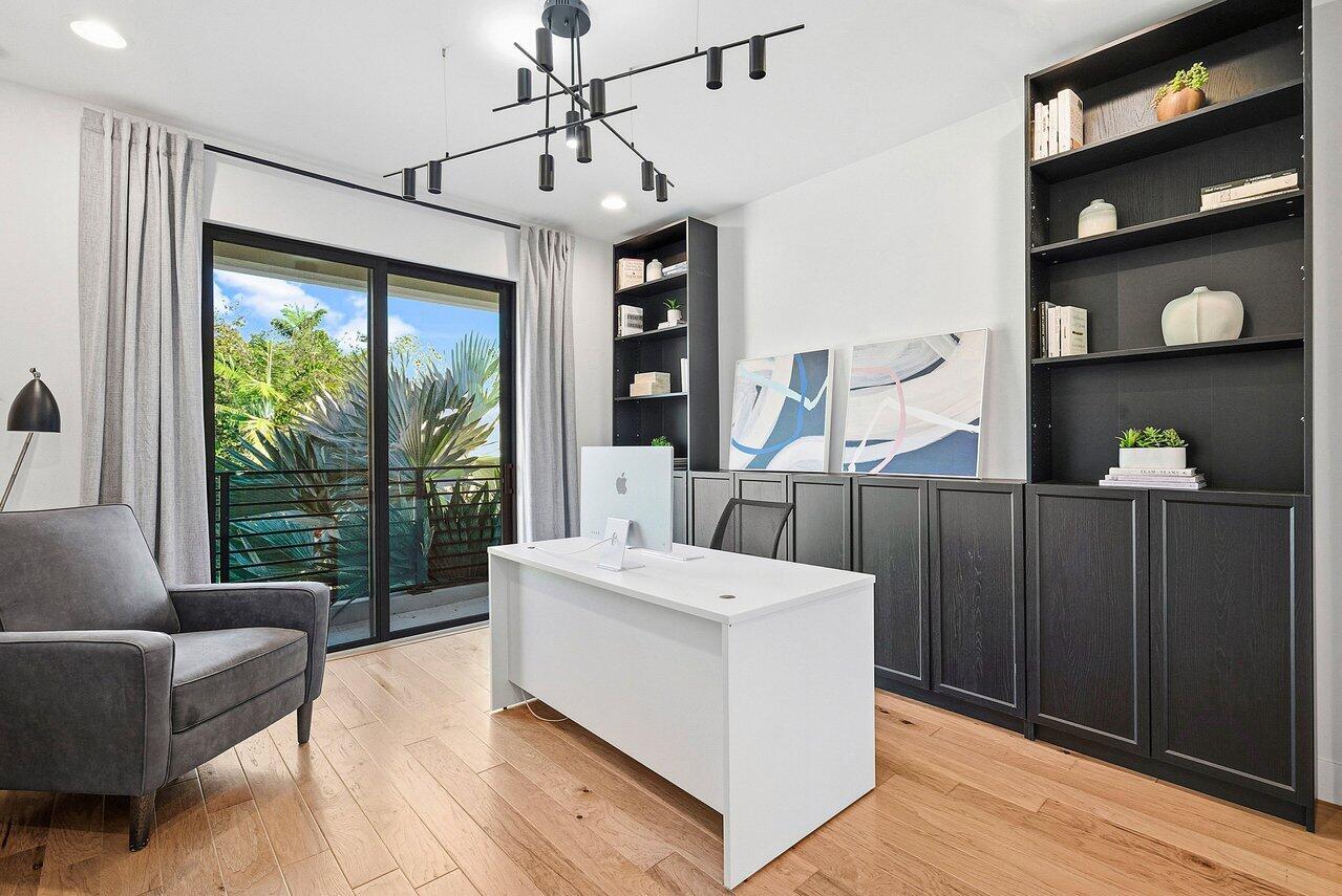 8092 Laurel Falls Drive Boca Raton, FL 33496 - Photo 24 of 62 a living room with furniture large window and wooden floor