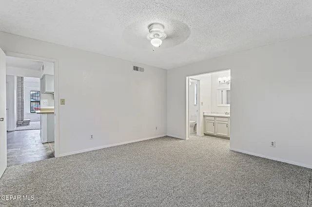 a view of a room with cabinet and wooden floor
