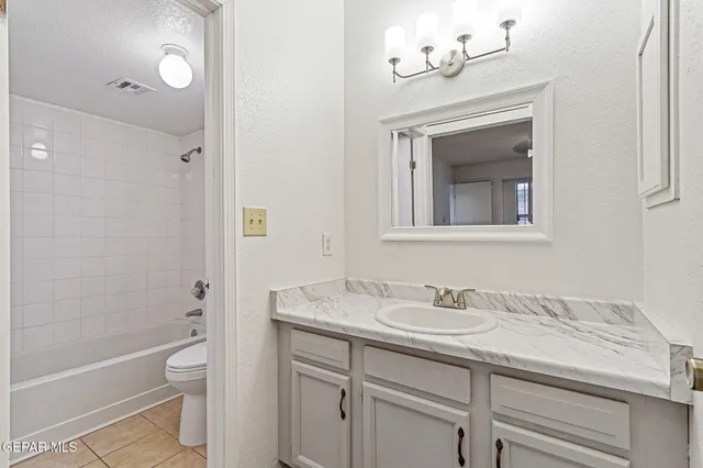 a bathroom with a sink a toilet and a bathtub