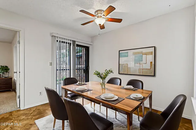 a view of a dining room with furniture and window