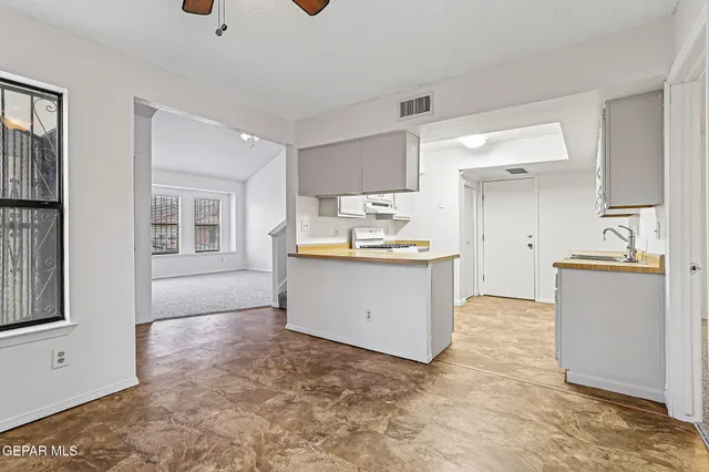 a view of a kitchen with a sink