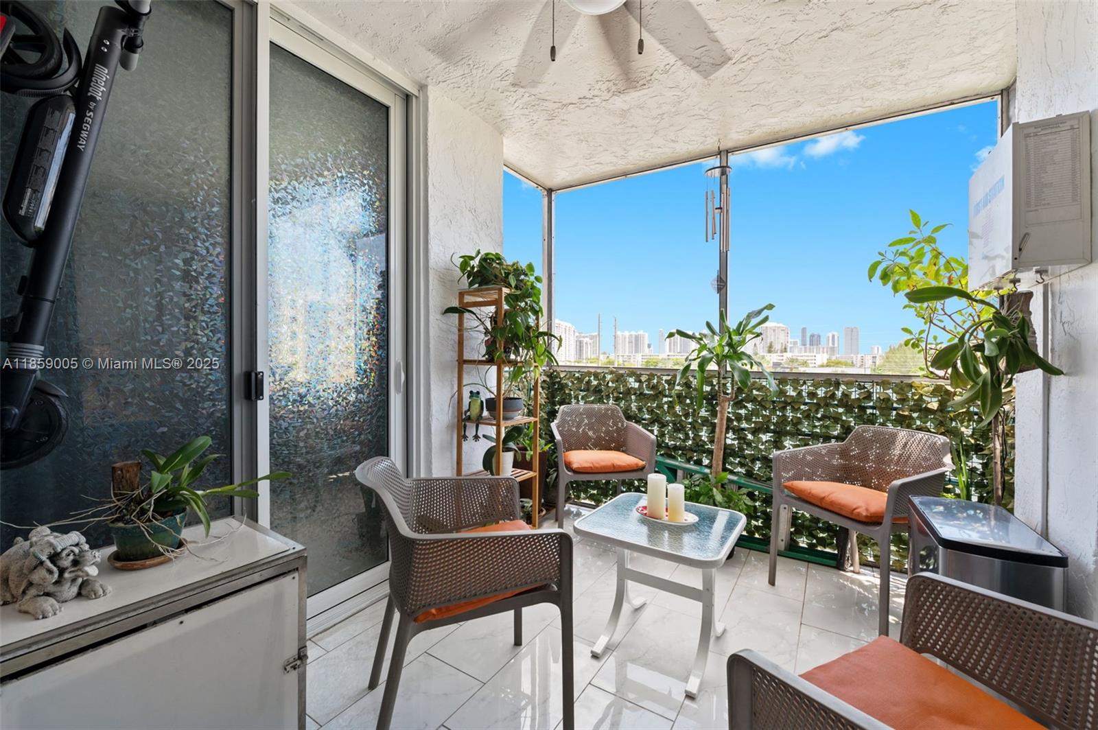 17890 West Dixie Highway, Unit 603 Miami, FL 33160 - Photo 14 of 34 a outdoor living space with furniture and potted plants
