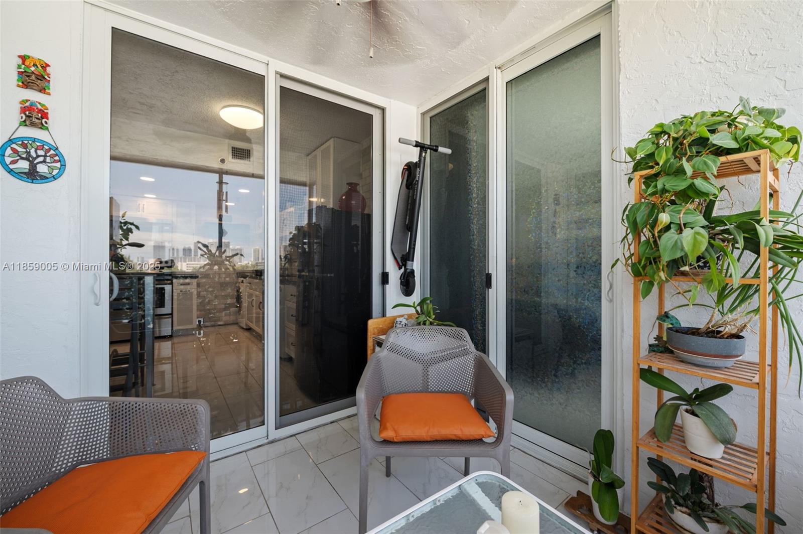17890 West Dixie Highway, Unit 603 Miami, FL 33160 - Photo 15 of 34 a living room with furniture and a potted plant