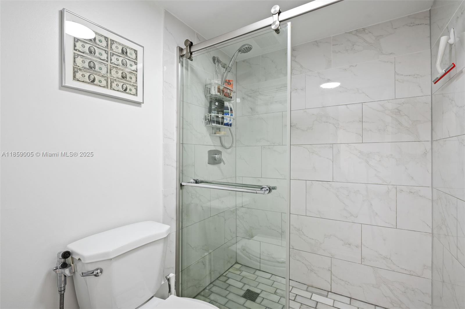 17890 West Dixie Highway, Unit 603 Miami, FL 33160 - Photo 23 of 34 a bathroom with a shower and toilet
