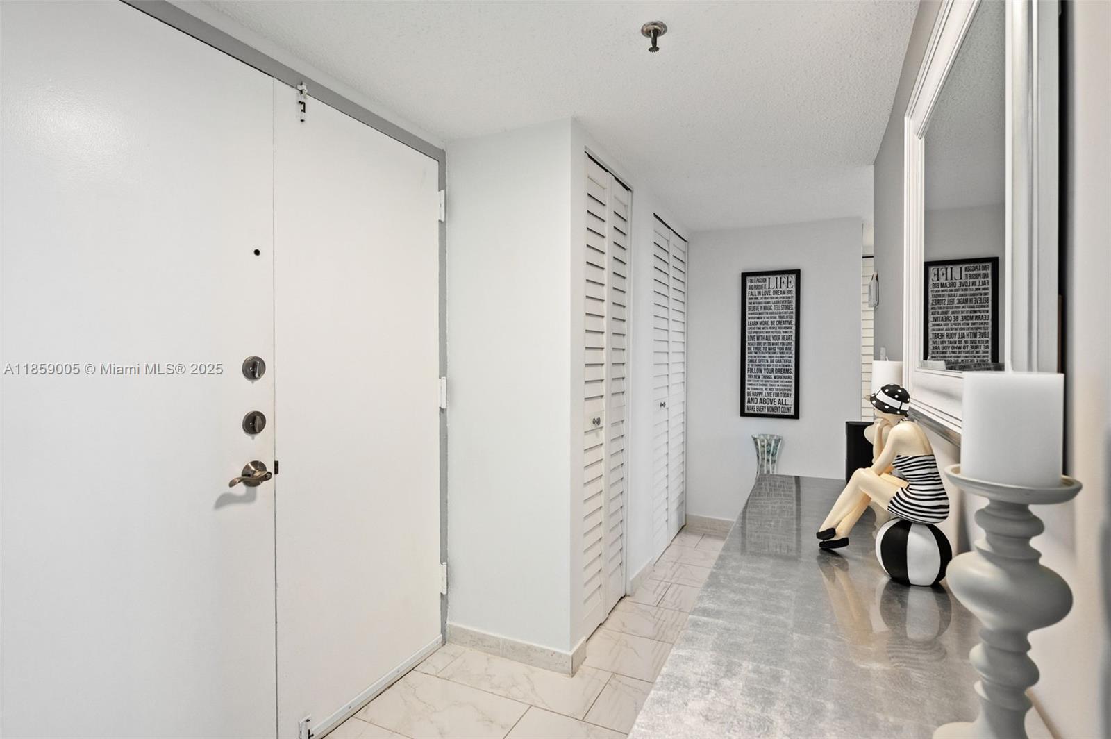 17890 West Dixie Highway, Unit 603 Miami, FL 33160 - Photo 3 of 34 a view of a room with gym equipment