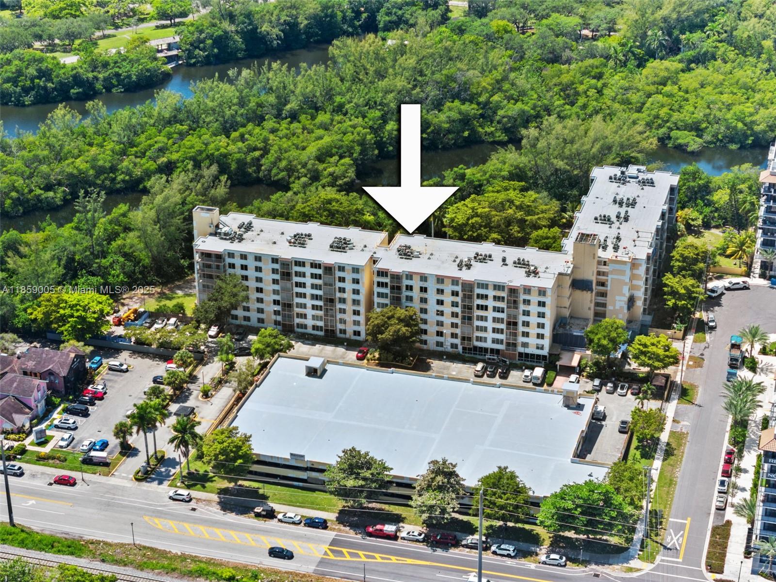 17890 West Dixie Highway, Unit 603 Miami, FL 33160 - Photo 33 of 34 an aerial view of multiple houses with yard