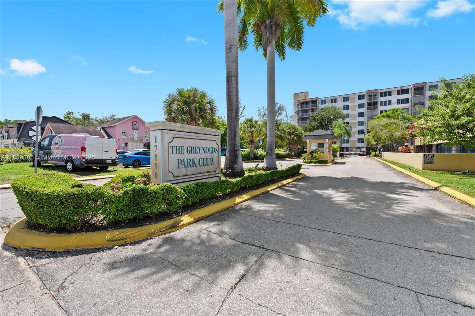 17890 West Dixie Highway, Unit 603 Miami, FL 33160 - Photo 34 of 34 a view of a chair and table in the garden