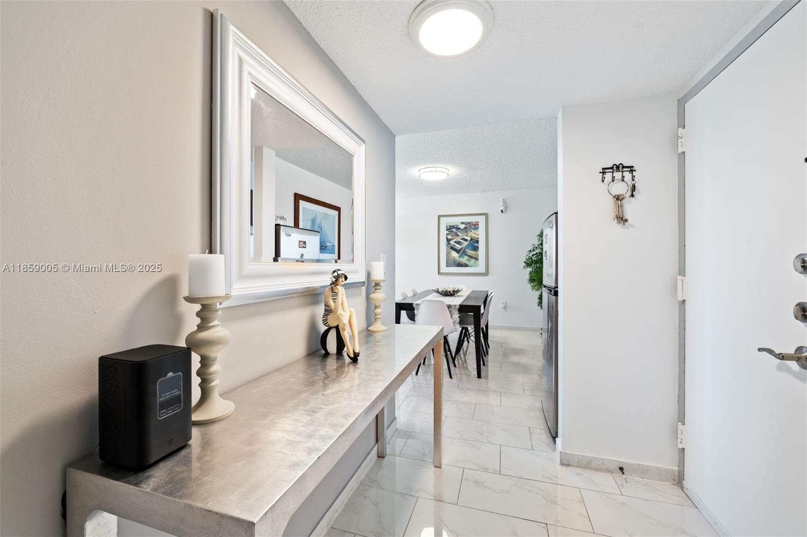 17890 West Dixie Highway, Unit 603 Miami, FL 33160 - Photo 4 of 34 a view of a livingroom with furniture and a window