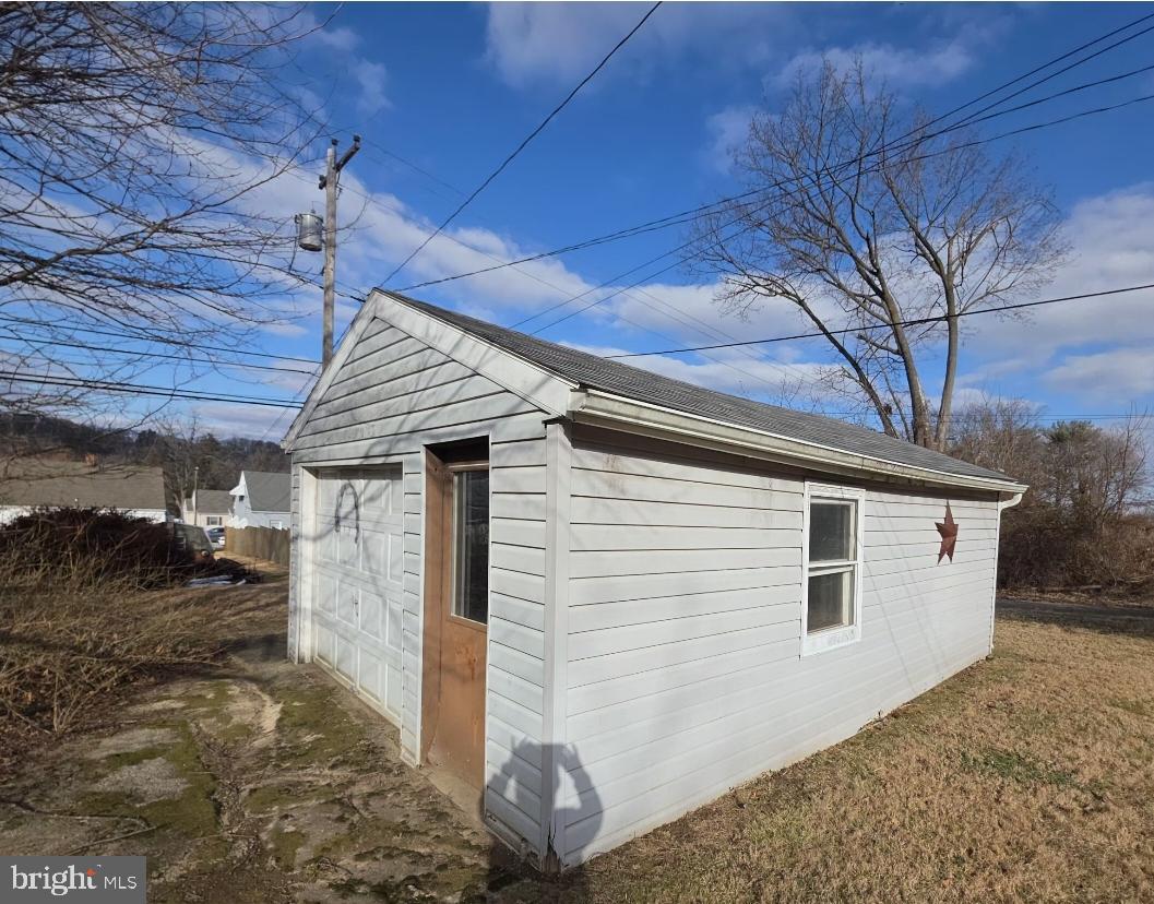 1407 Walnut Street Coatesville, PA 19320 - Photo 5 of 9 Shed with a garage door on it