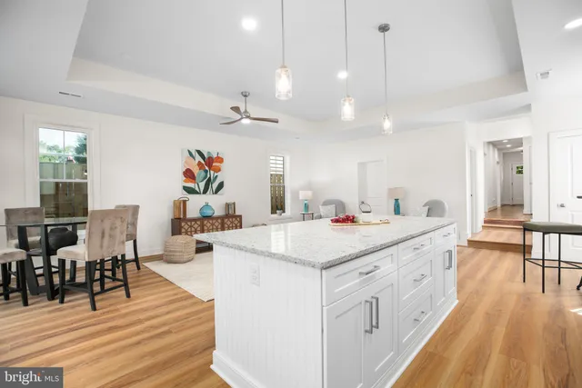 a view of a kitchen and dining room