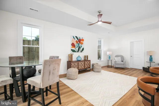 a bedroom with a bed a table and chair