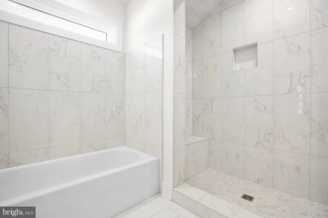 a bathroom with a shower and a bathtub