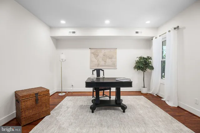 a view of a workspace with furniture