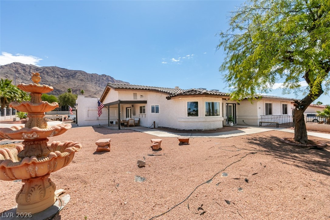 892 North Hollywood Boulevard Las Vegas, NV 89110 - Photo 60 of 81 This charming home offers mountain views, a welcoming front porch, and a decorative fountain.