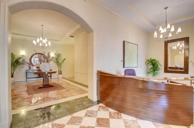 a view of a living room and chandelier