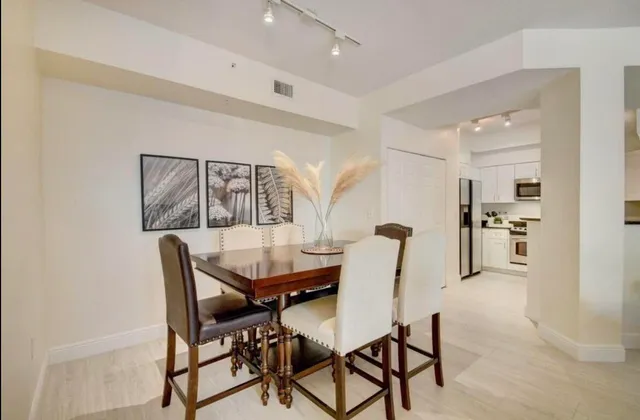 a dining room with furniture and window