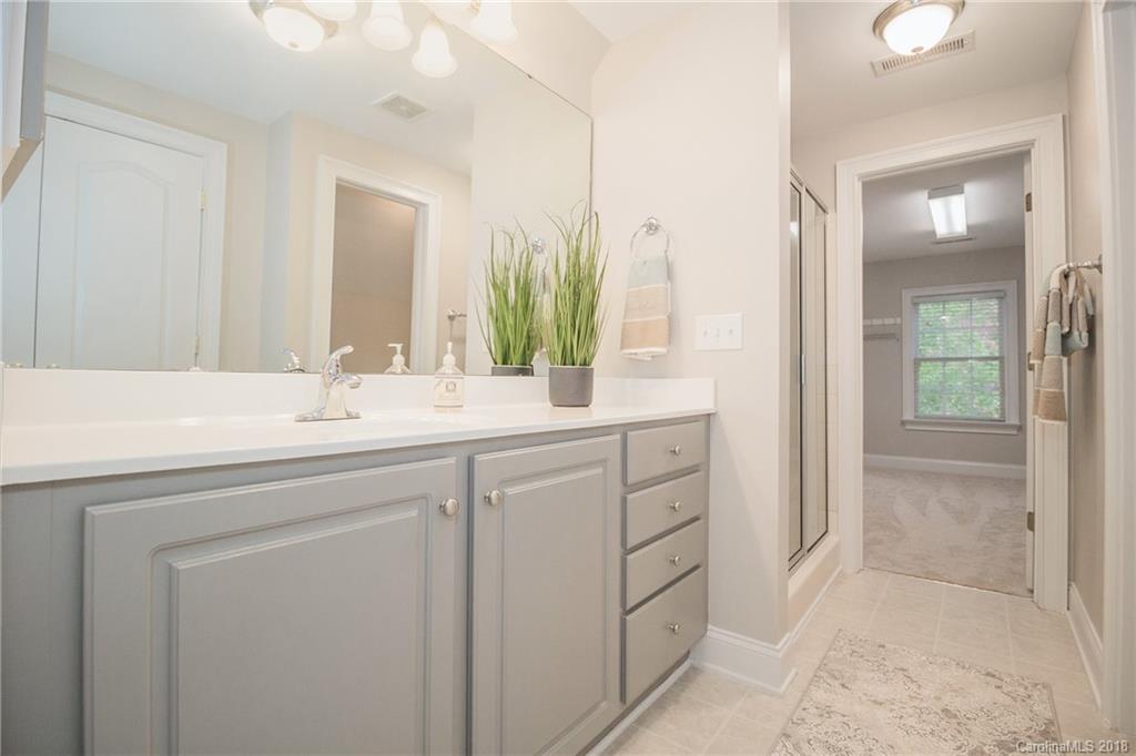1376 Barnett Woods Fort Mill, SC 29708 - Photo 17 of 34 a bathroom with a sink and a mirror