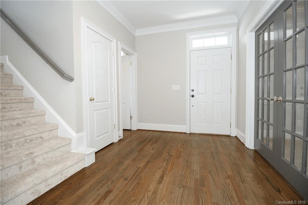 1376 Barnett Woods Fort Mill, SC 29708 - Photo 4 of 34 a view of a hallway with wooden floor and entryway