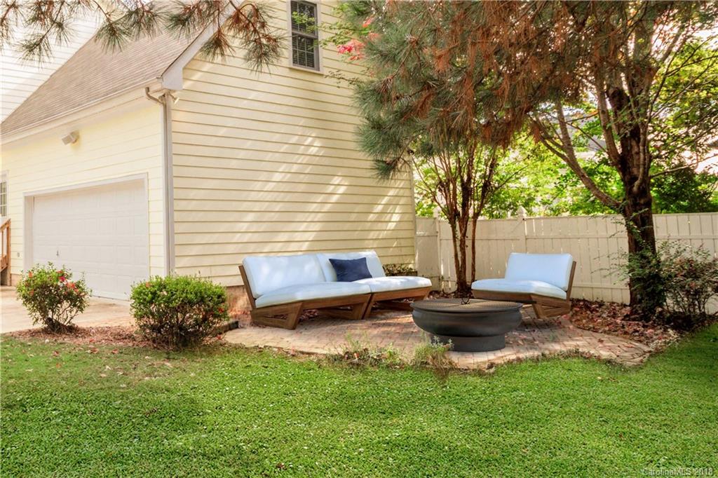 1376 Barnett Woods Fort Mill, SC 29708 - Photo 31 of 34 a view of a backyard with plants and a patio