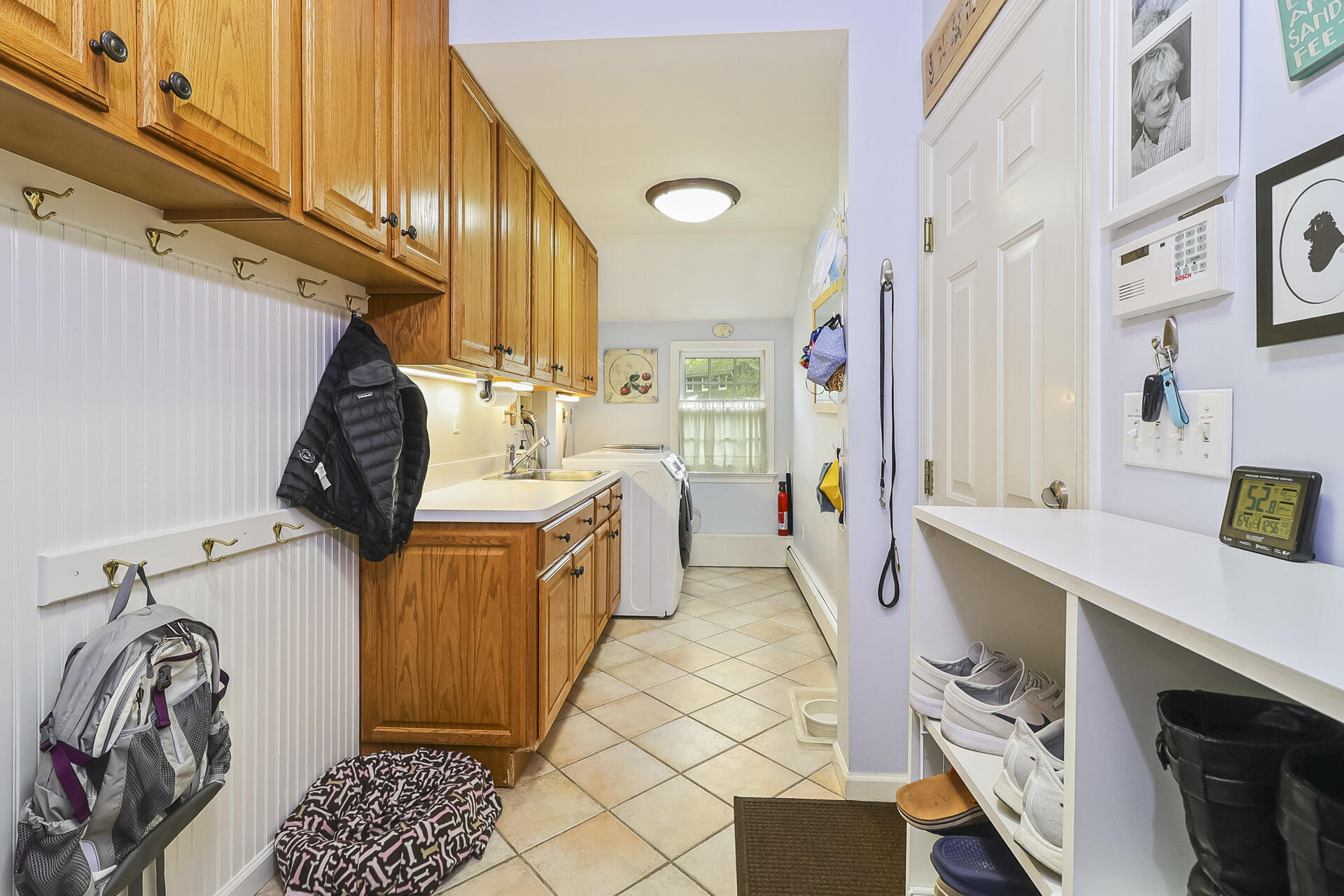 37 Red Rose Circle Darien, CT 06820 - Photo 16 of 40 a utility room with multiple dryer and washer